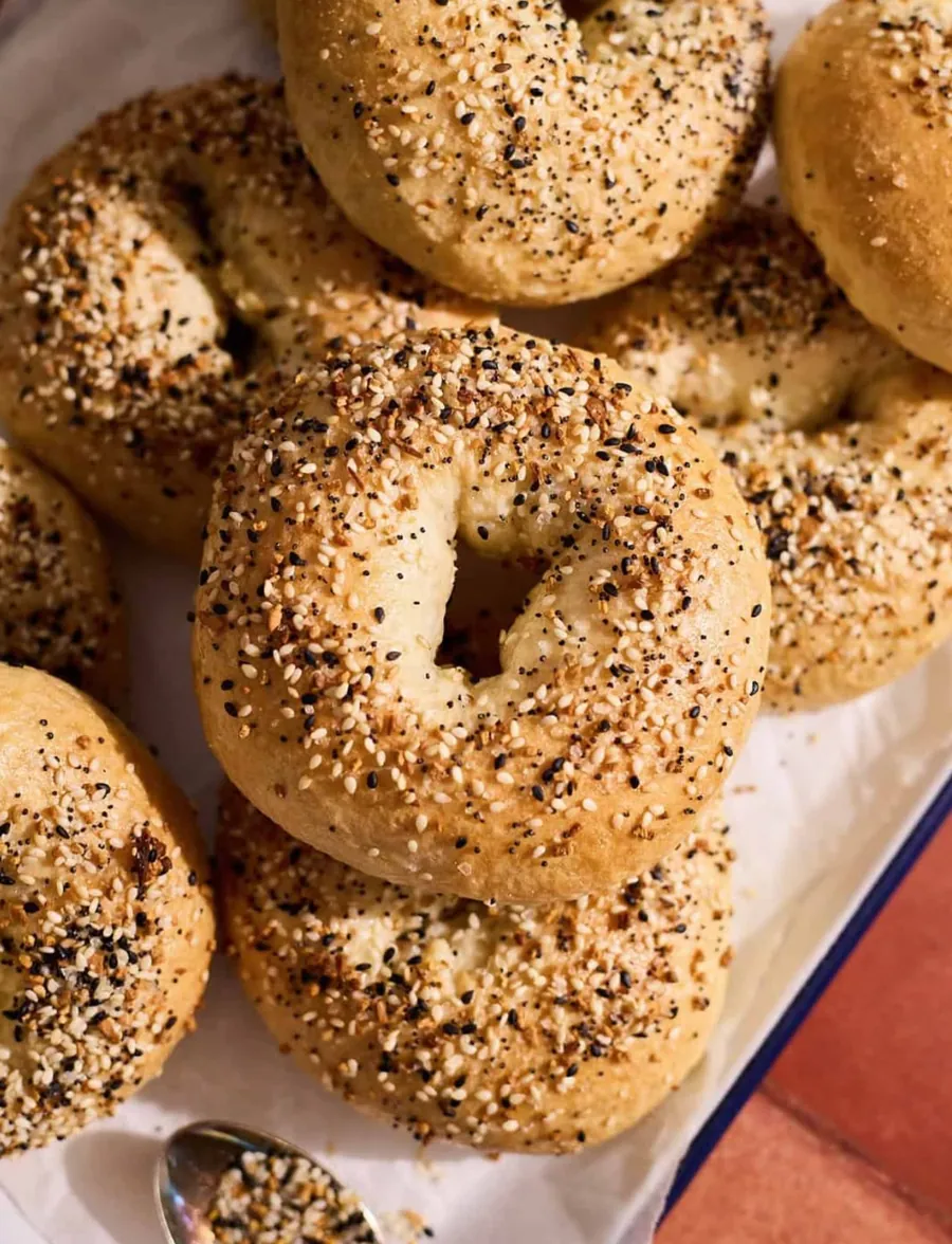 Everything sourdough bagels topped with garlic, onion, sesame and poppy seeds, sold by the half dozen