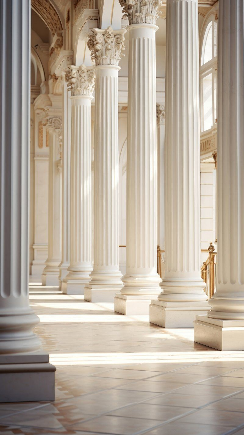Sunlit classical marble colonnade at golden hour, evoking the timeless heritage brands YQR Design builds in Regina
